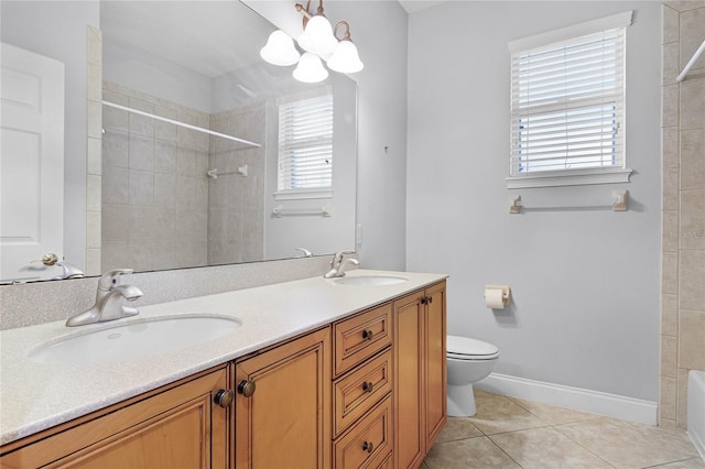 full bath with tile patterned flooring, a sink, and a tile shower