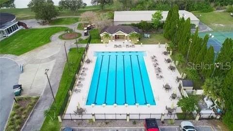 view of swimming pool with fence