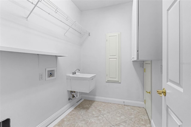 674 Whisper Woods Dr, Lakeland, FL 33813 - laundry area featuring hookup for a washing machine, light tile patterned flooring, cabinet space, and baseboards