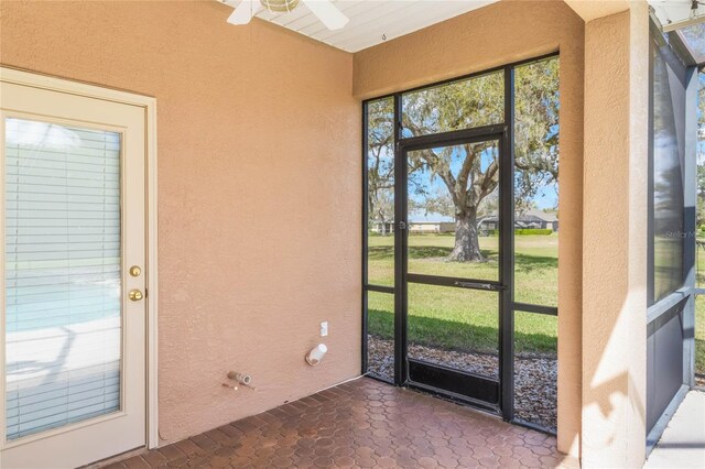 674 Whisper Woods Dr, Lakeland, FL 33813 - unfurnished sunroom featuring ceiling fan