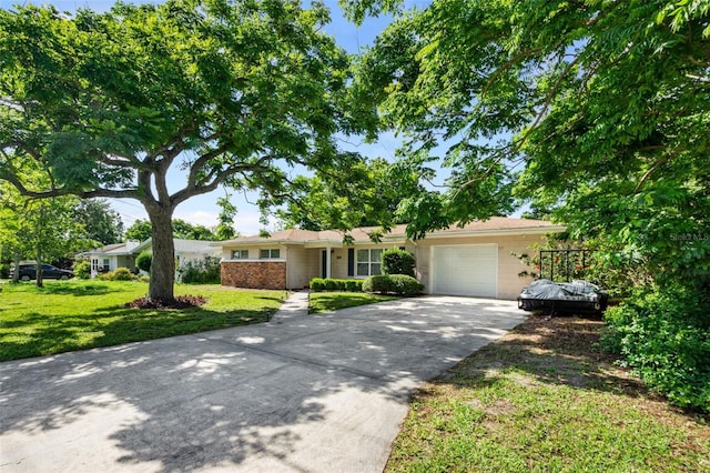 ranch-style home featuring a garage, driveway, and a front lawn