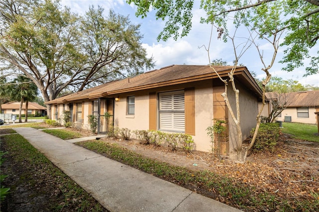 ranch-style house with stucco siding