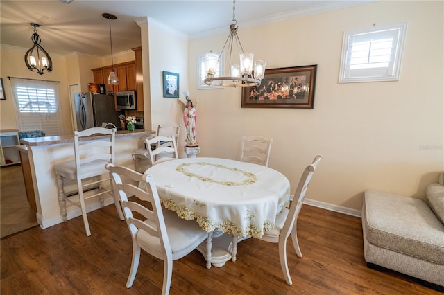 dining room featuring wood finished floors, a wealth of natural light, and a chandelier