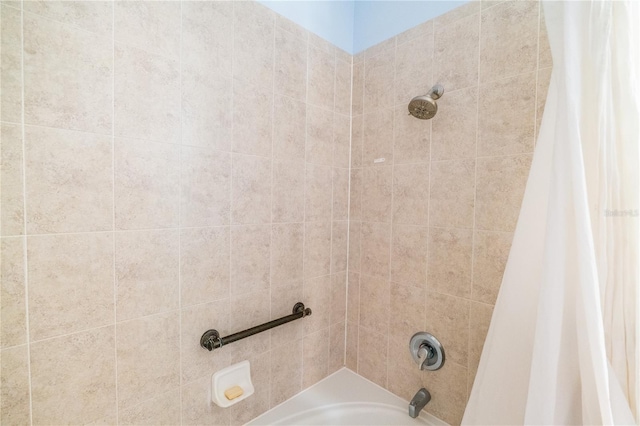 interior details featuring shower / bath combo with shower curtain