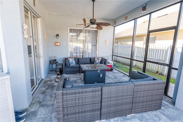 sunroom / solarium with a ceiling fan