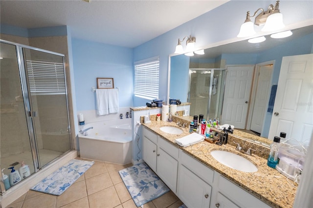 full bath with double vanity, a stall shower, a sink, a tub with jets, and tile patterned floors