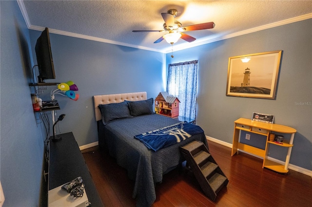 bedroom featuring a textured ceiling, baseboards, crown molding, and wood finished floors