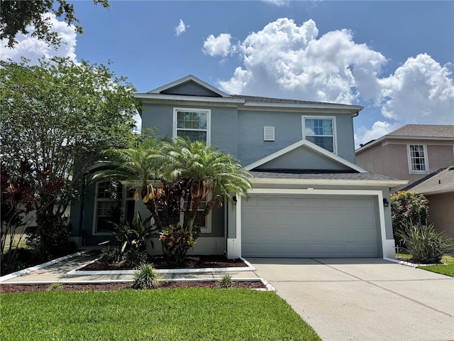 14415 Estrella Dr, Orlando, FL 32837 - traditional-style home with concrete driveway, stucco siding, and a garage