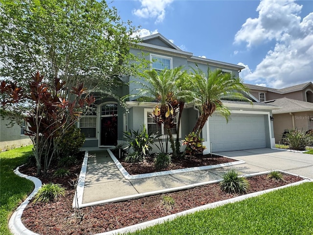 14415 Estrella Dr, Orlando, FL 32837 - view of property hidden behind natural elements with stucco siding, an attached garage, and concrete driveway