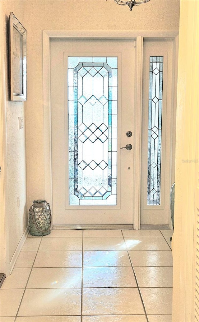 entryway featuring a wealth of natural light and tile patterned floors