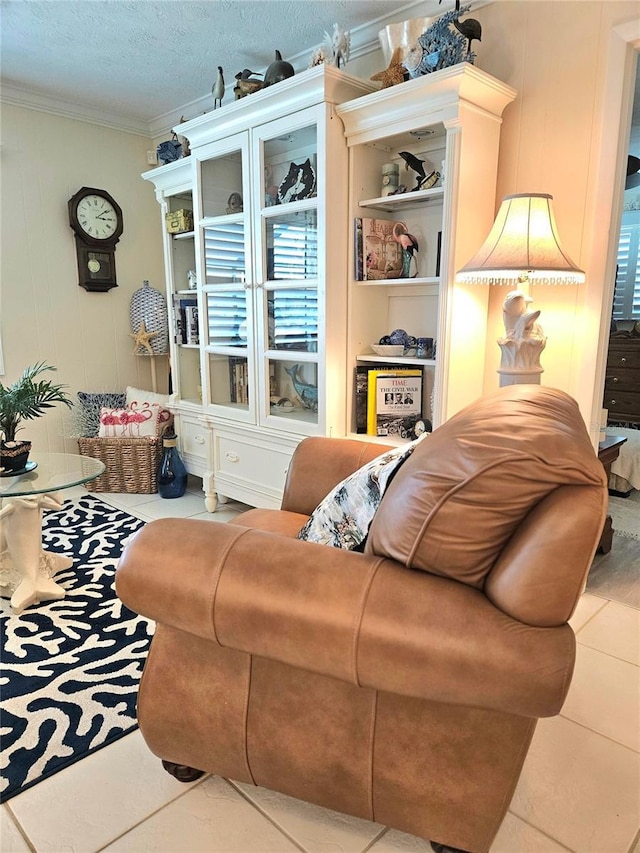 1706 S Lakeside Ct, Venice, FL 34293 - tiled living room featuring a textured ceiling and crown molding
