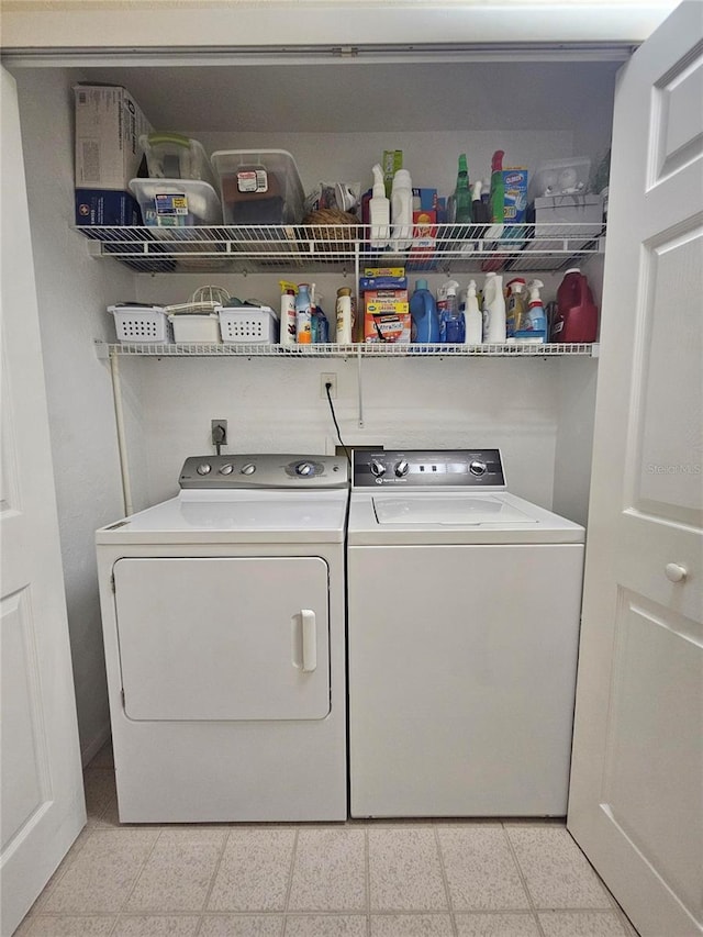 1706 S Lakeside Ct, Venice, FL 34293 - washroom with washer and clothes dryer, laundry area, and light floors
