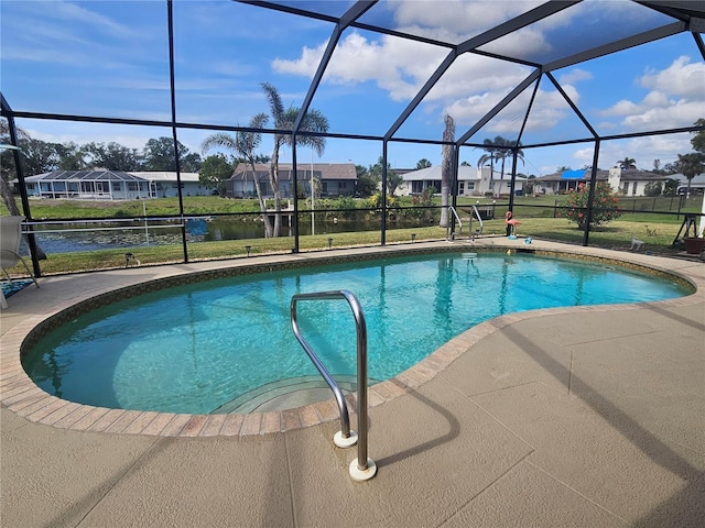 1706 S Lakeside Ct, Venice, FL 34293 - pool featuring a residential view, glass enclosure, a yard, and a patio area