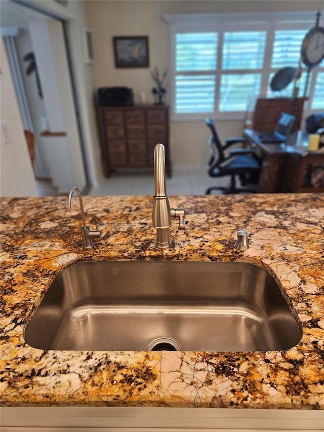 1706 S Lakeside Ct, Venice, FL 34293 - room details featuring a sink and stone countertops