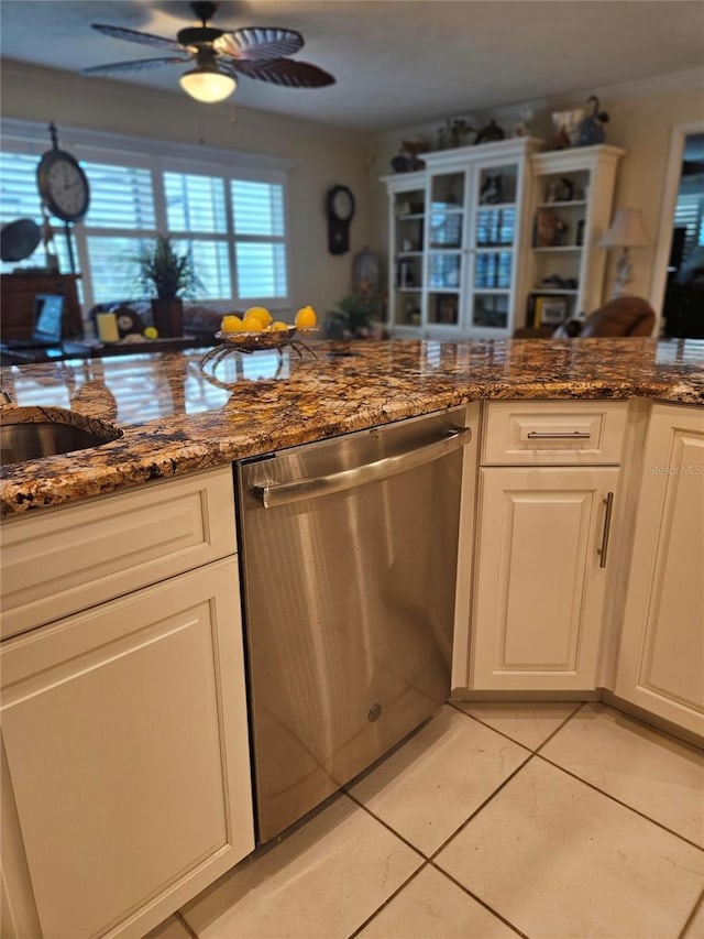 1706 S Lakeside Ct, Venice, FL 34293 - kitchen featuring dishwasher, light tile patterned floors, white cabinets, ceiling fan, and dark stone counters