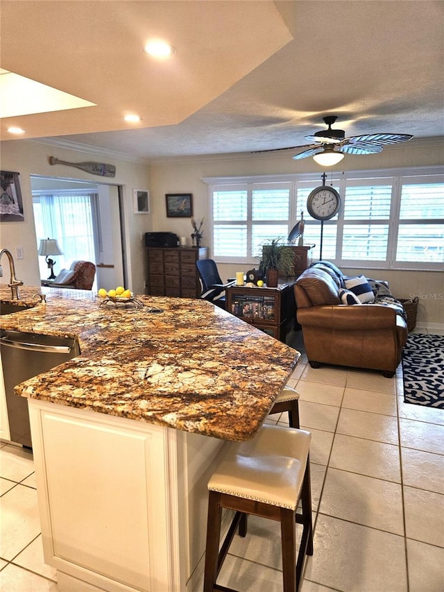 1706 S Lakeside Ct, Venice, FL 34293 - kitchen featuring open floor plan, a ceiling fan, a wealth of natural light, and stainless steel dishwasher