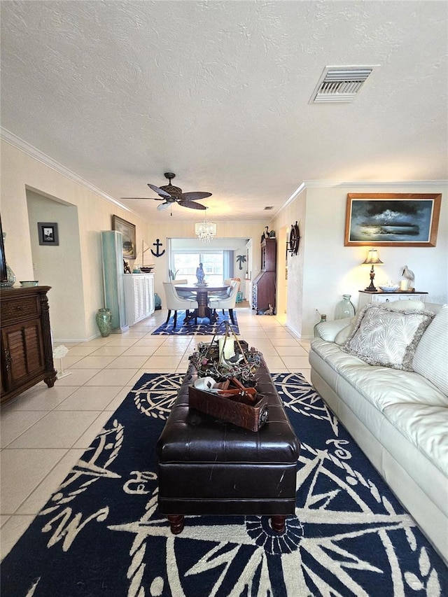 1706 S Lakeside Ct, Venice, FL 34293 - living room featuring a textured ceiling, visible vents, crown molding, and light tile patterned floors
