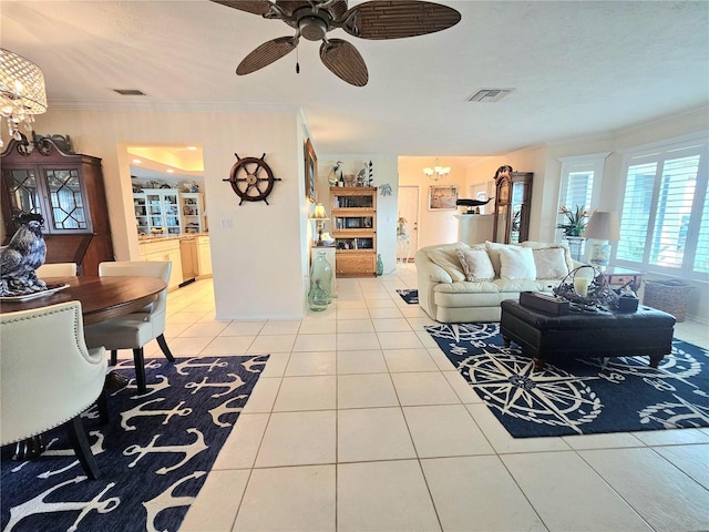 1706 S Lakeside Ct, Venice, FL 34293 - living room with visible vents, tile patterned floors, crown molding, and ceiling fan with notable chandelier