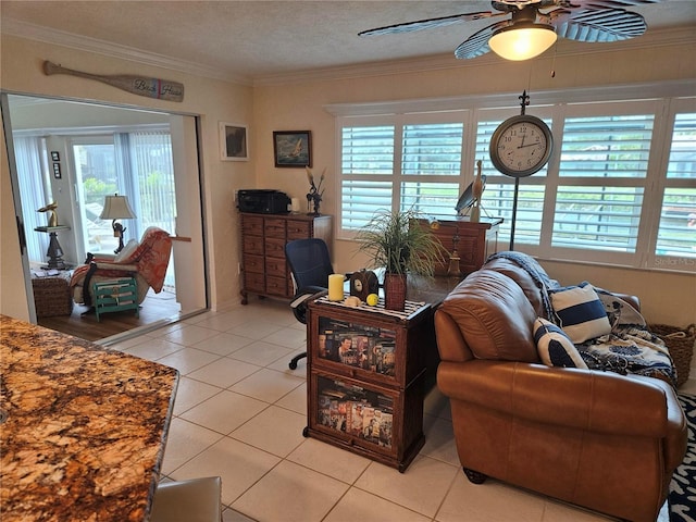 1706 S Lakeside Ct, Venice, FL 34293 - living area featuring light tile patterned floors, a textured ceiling, ceiling fan, and crown molding