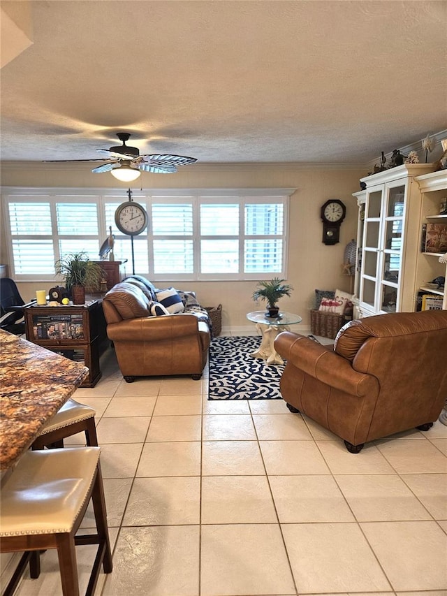 1706 S Lakeside Ct, Venice, FL 34293 - living area featuring a ceiling fan, light tile patterned floors, and plenty of natural light