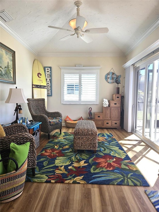 1706 S Lakeside Ct, Venice, FL 34293 - sitting room with vaulted ceiling, wood finished floors, and ornamental molding