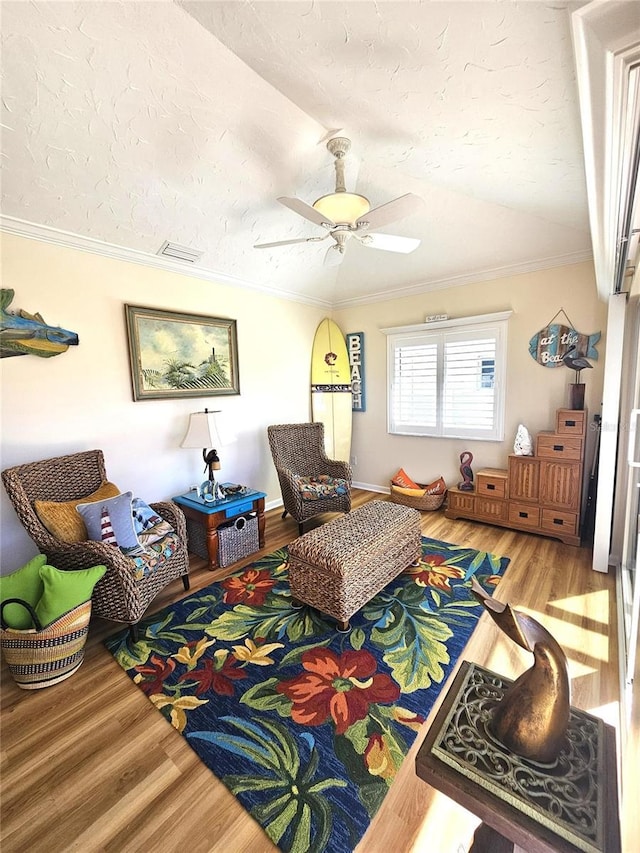1706 S Lakeside Ct, Venice, FL 34293 - living area featuring visible vents, crown molding, wood finished floors, and ceiling fan