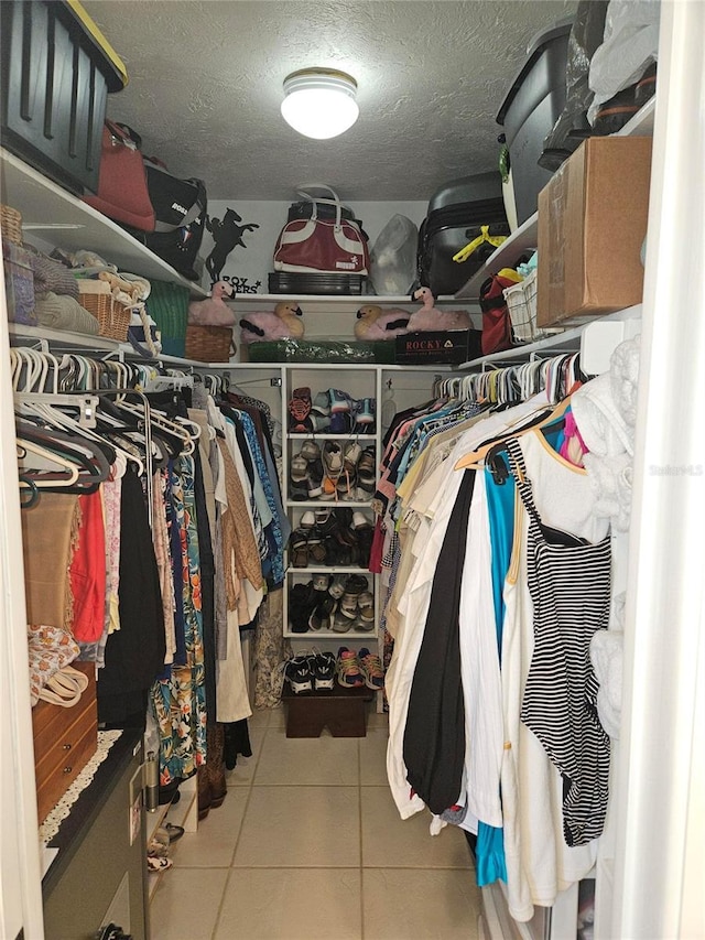 1706 S Lakeside Ct, Venice, FL 34293 - walk in closet featuring tile patterned flooring