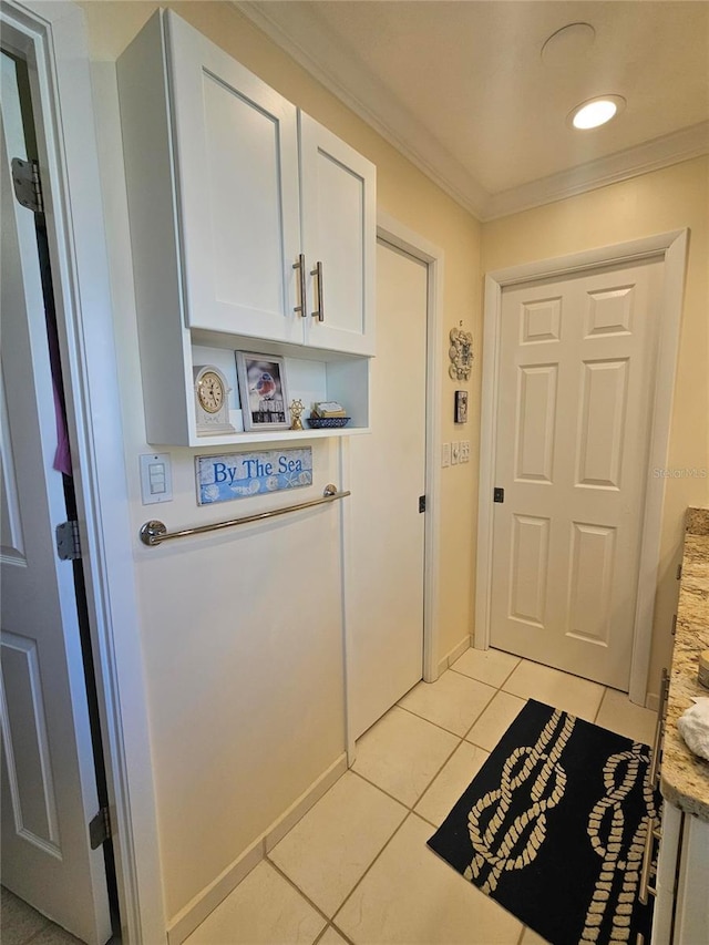 1706 S Lakeside Ct, Venice, FL 34293 - entryway featuring light tile patterned floors, crown molding, baseboards, and recessed lighting