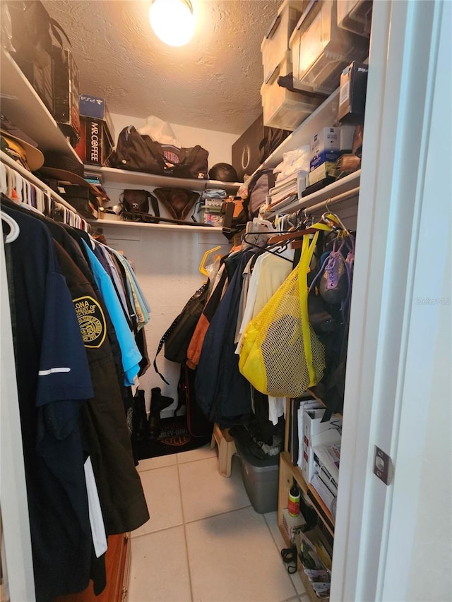 1706 S Lakeside Ct, Venice, FL 34293 - walk in closet with tile patterned floors