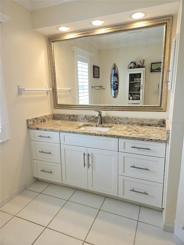 1706 S Lakeside Ct, Venice, FL 34293 - bathroom with baseboards, ornamental molding, tile patterned flooring, and vanity