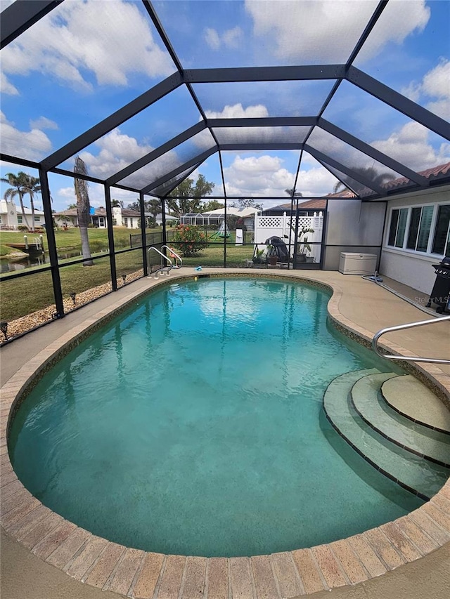 1706 S Lakeside Ct, Venice, FL 34293 - outdoor pool with glass enclosure and a patio