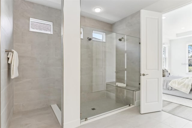 ensuite bathroom featuring a shower stall, tile patterned flooring, and ensuite bathroom