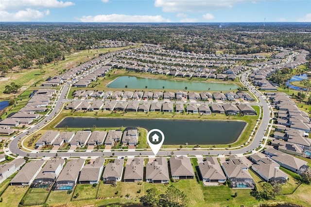 bird's eye view featuring a water view and a residential view