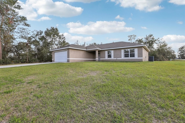 single story home with a garage, driveway, a front yard, and stucco siding