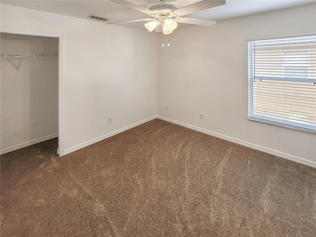 unfurnished bedroom with baseboards, visible vents, and carpet flooring