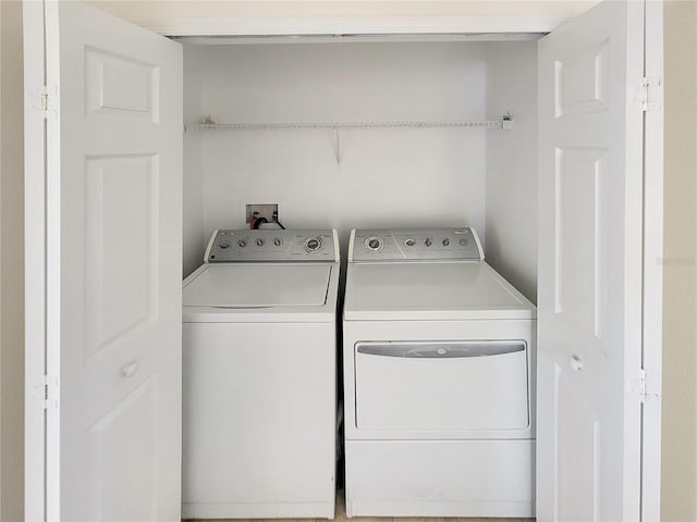 laundry room featuring washer and dryer and laundry area