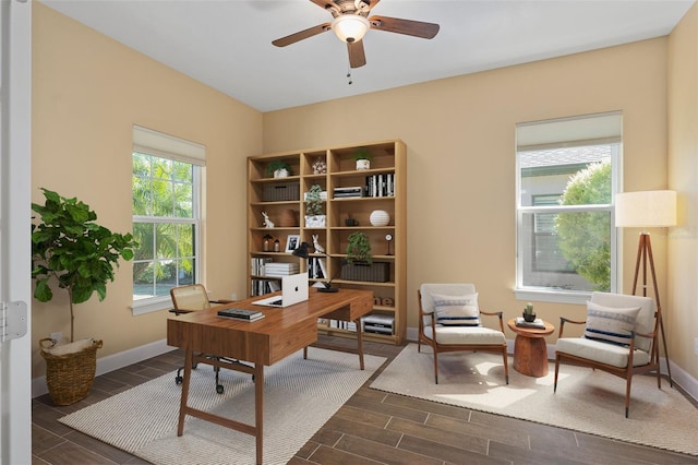 office area featuring a ceiling fan, wood finish floors, and baseboards