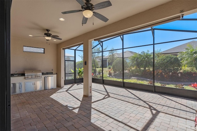 unfurnished sunroom featuring a sink