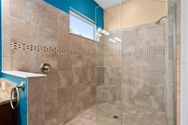 full bath with a tile shower