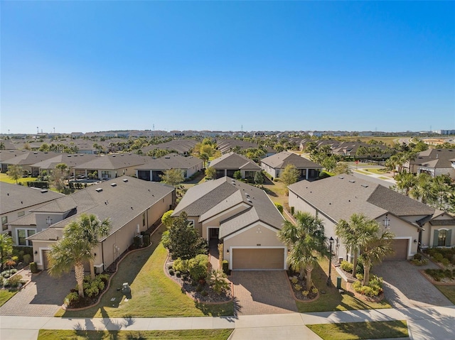 birds eye view of property with a residential view