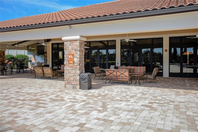 view of patio / terrace featuring ceiling fan and an outdoor living space