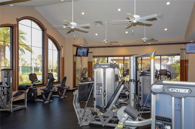 exercise room with lofted ceiling, visible vents, and recessed lighting