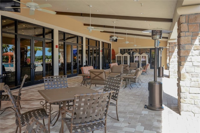 view of patio featuring an outdoor living space, french doors, ceiling fan, and outdoor dining area