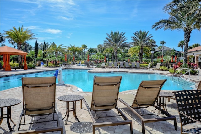 pool featuring a patio area and a gazebo