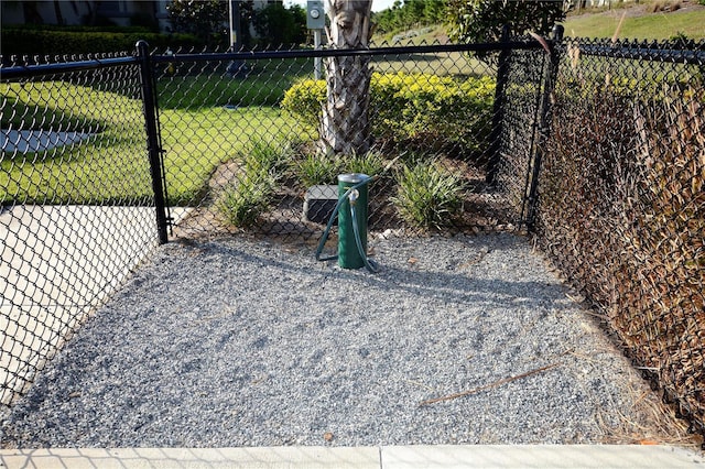 exterior space with a yard, a gate, and fence