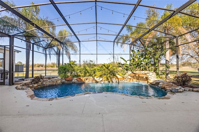 outdoor pool with a lanai and a patio