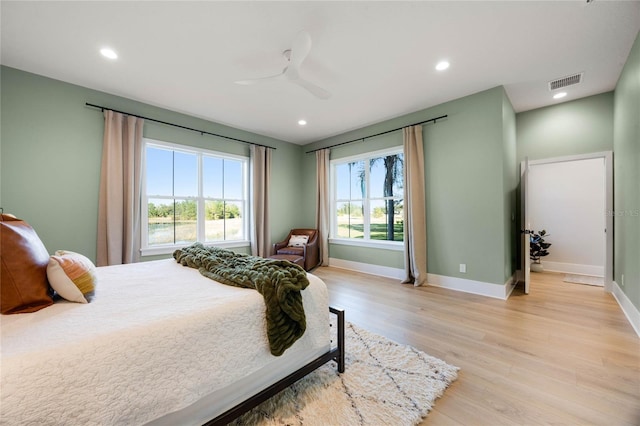 bedroom featuring visible vents, recessed lighting, light wood finished floors, baseboards, and ceiling fan