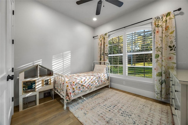 bedroom featuring recessed lighting, ceiling fan, baseboards, and wood finished floors