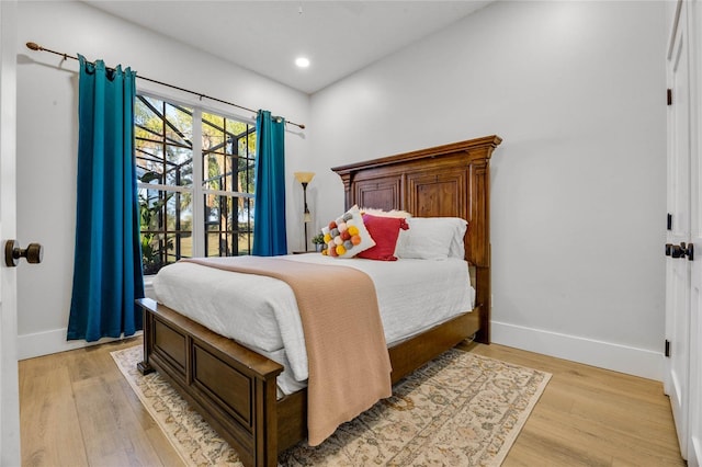 bedroom featuring recessed lighting, baseboards, and light wood-style floors