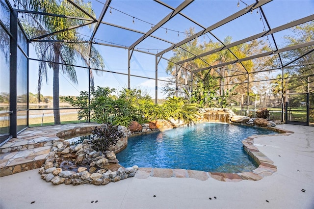 pool featuring glass enclosure and a patio